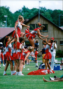 American Football -  the phenomenon of specially trained heels of girls has also come here from the USA. - Vintage Photograph