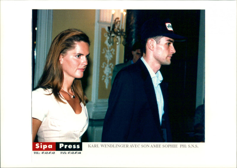 Karl Wendlinger, who was seriously injured in the Monaco Grand Prix, with his girlfriend Sophie and Dr. Erich Schmutzhardt. - Vintage Photograph