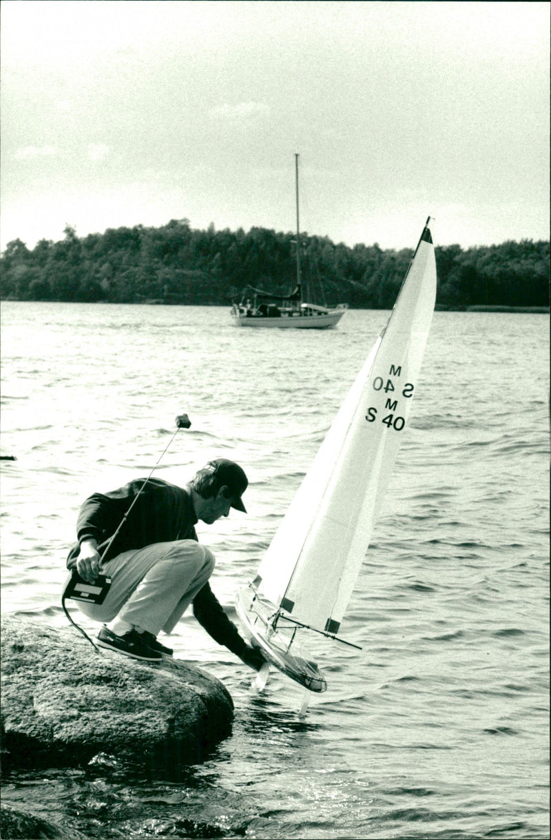 An advantage of the class of radio-controlled boats is that the ships can be munched on land. - Vintage Photograph