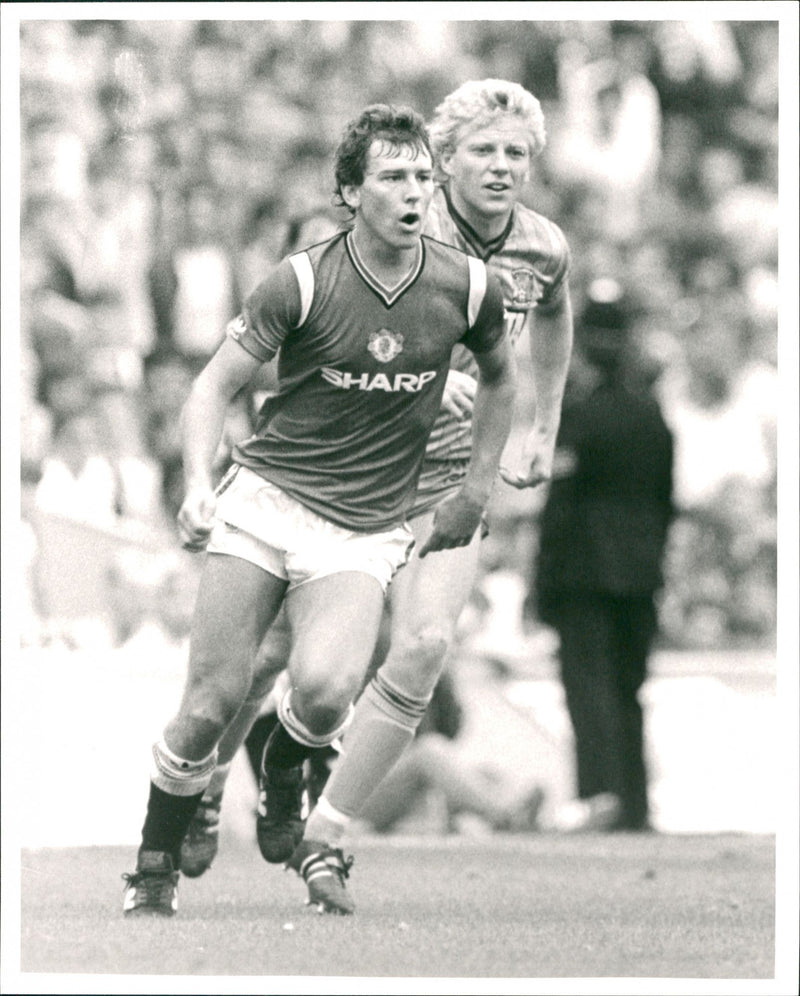 Bryan Robson (Manchester Utd) and Nicky Platnauer (Coventry City) - Vintage Photograph