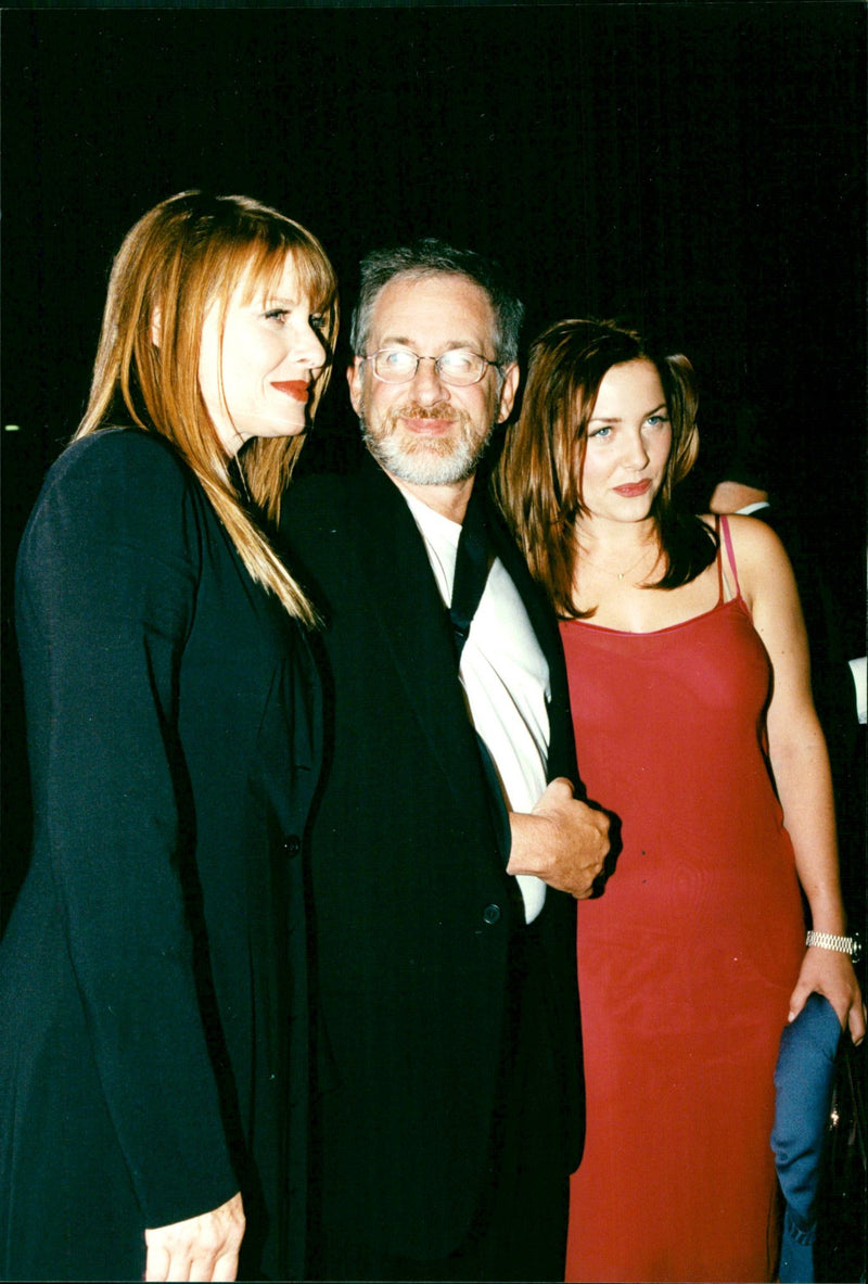 Steven Spielberg with his wife Kate Capshaw and her daughter Jessica at the film premiere of "The Locusts" - Vintage Photograph