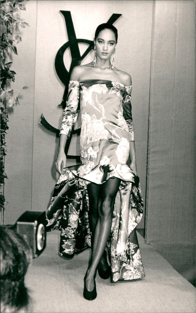 Fashion Model Wearing A Feminine Gown Designed by Yves St Laurent - Vintage Photograph