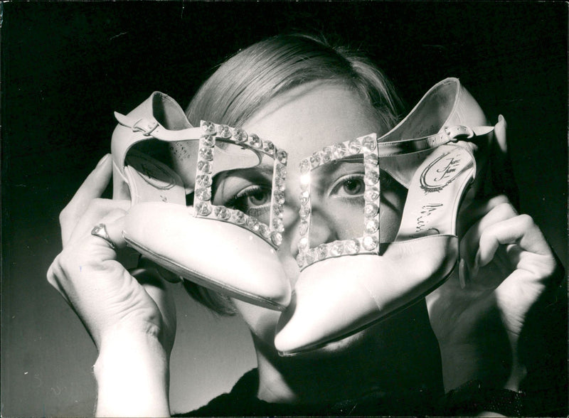 Female Model Holding a Shoes with a Diamond Buckle from 1960s Fashion - Vintage Photograph