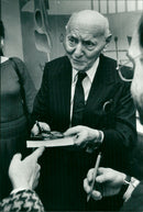 Isaac Bashevis Singer Signing an Autograph in his Books - Vintage Photograph
