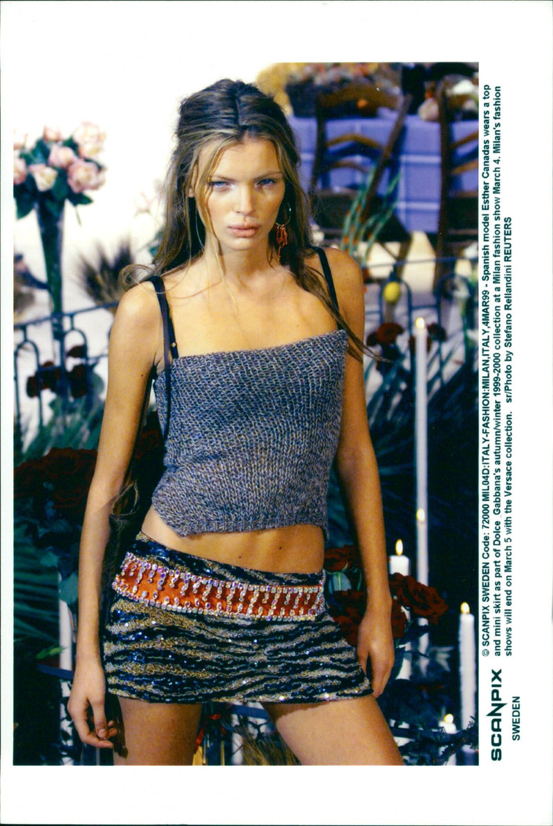 Spanish model Esther Canadas wears a top and mini skirt as part of Dolce Gabbana's autumn/winter 1999-2000 collection at a Milan fashion show. - Vintage Photograph