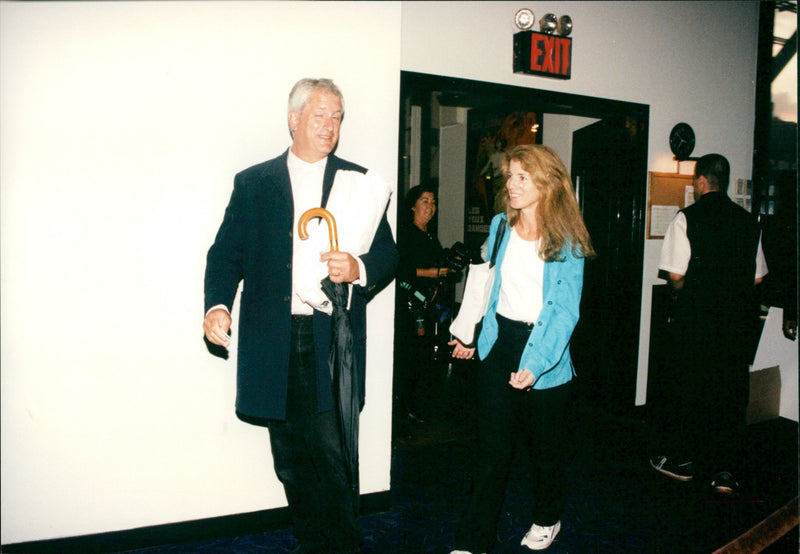 Caroline Kennedy Schlossberg, was assailed by a bevy of photographers as she and her husband came out of a movie theater in New York. - Vintage Photograph