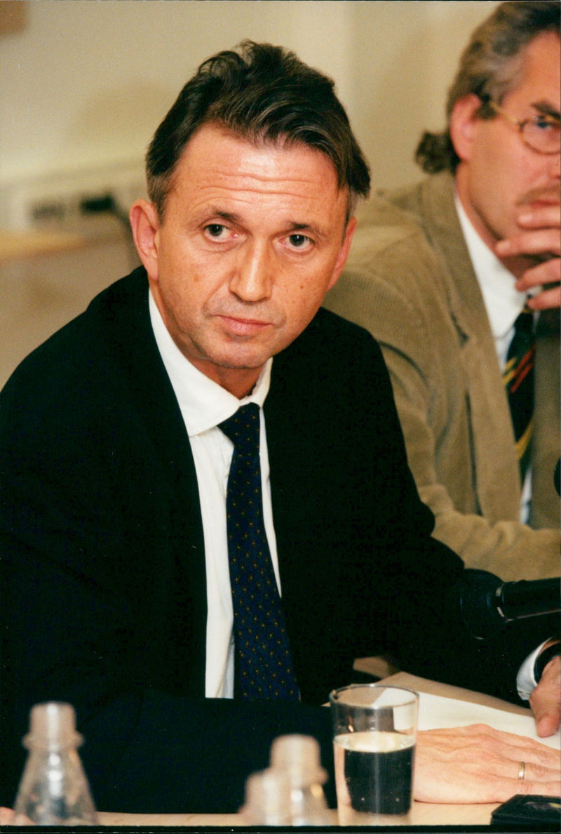 Norwegian Planning Minister Terje Rød Larsen in a press conference. - Vintage Photograph