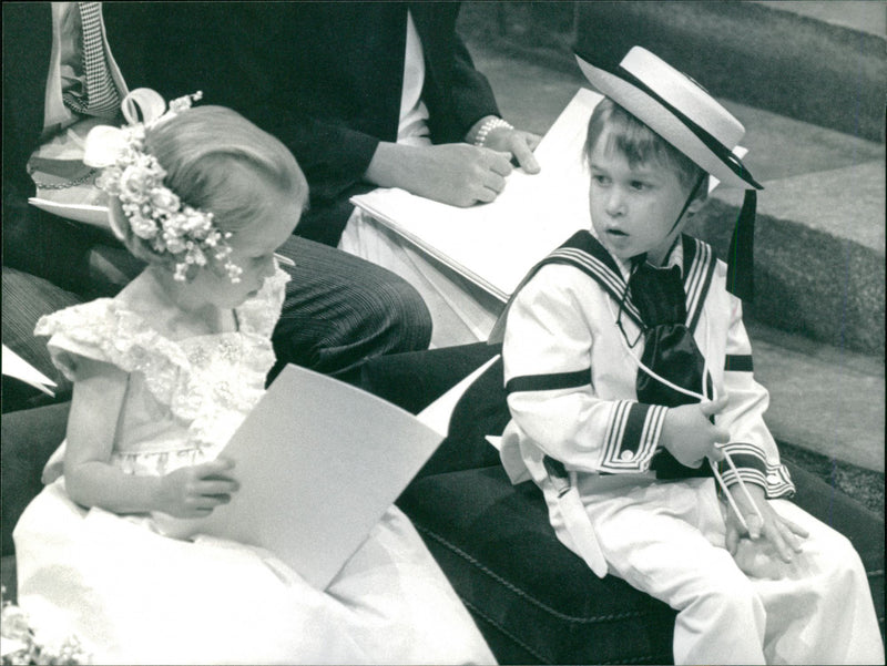 Prince William looks at his cousin Laura Fellowes during the wedding ceremony of Prince Andrew - Vintage Photograph