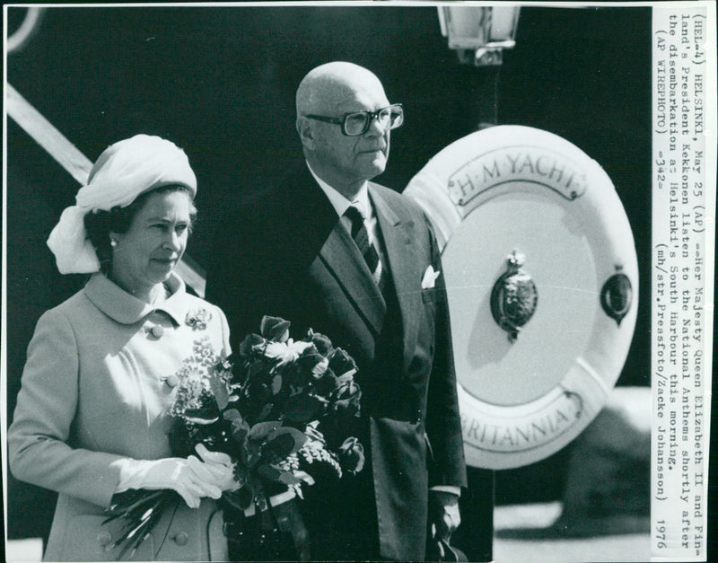 Her Majesty Queen Elizabeth II and Finland's President Kekkonen listen to the National Anthems shortly after the disembarkation at Helsinki's South Harbour. - Vintage Photograph