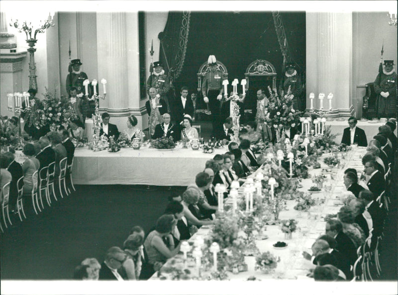 Urho Kekkonen, President of Finland, at Buckingham Palace banquet with Prince Charles, Queen Elizabeth and Queen Elizabeth II. - Vintage Photograph