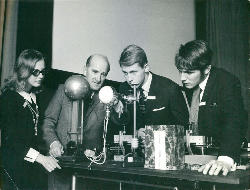 The Berzilian Days at the Technical Museum. Svante Björkman demonstrates the properties of electrons for fellows Kerstin Dahlberg, Lennart Berglund and Kjell Eriksson - Vintage Photograph