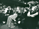 Klaus von Klitzing's children Andreas, Christine and Thomas and his wife Renate await the Nobel Prize ceremony in the concert hall. - Vintage Photograph