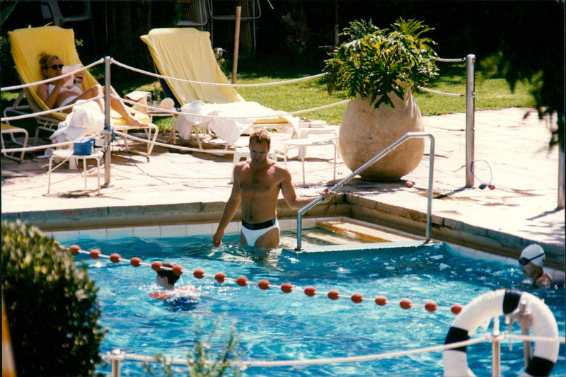 Sting and Trudie Styler at the hotel pool in Jerusalem - Vintage Photograph