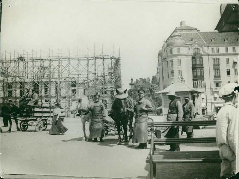 Stockholm: Krook's hat-clad horses and in the background Dramatic Theater under construction - Vintage Photograph