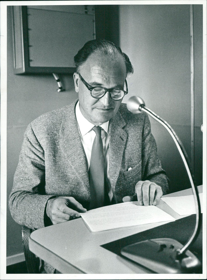 Uno Stenholm, reads news in the answering machine. - Vintage Photograph