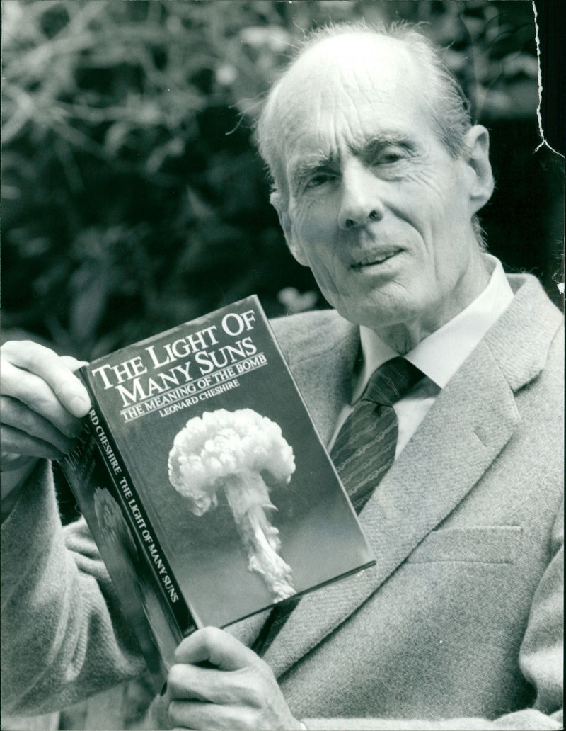 Group Captain Leonard Cheshire with his book "The Light of Many Suns" - Vintage Photograph