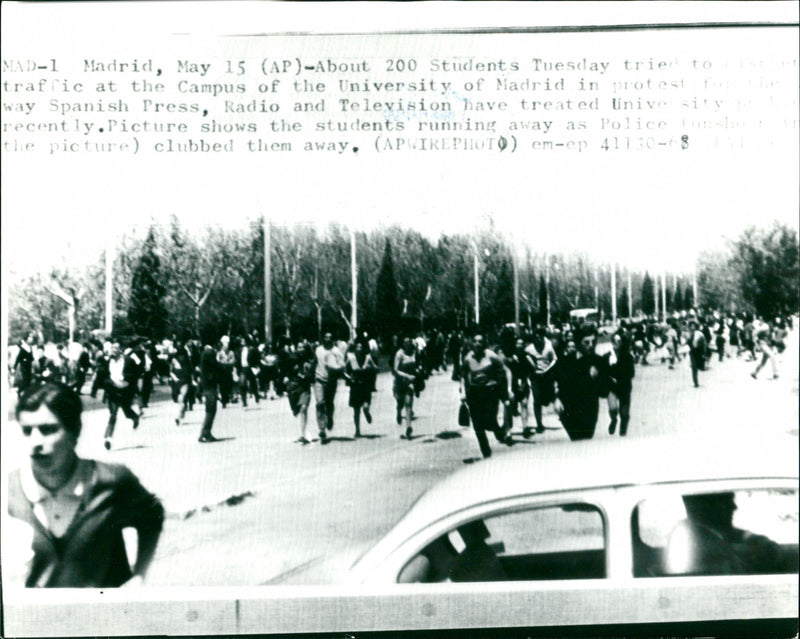 Spanish students run away from police after demonstration in Madrid - Vintage Photograph