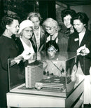 The model of the SvD house is studied by Mrs Speller, Mrs Wise, Mrs Kidd and the women Friberg and Winterö - Vintage Photograph
