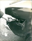 Opening a Gas Cap Cover - Vintage Photograph