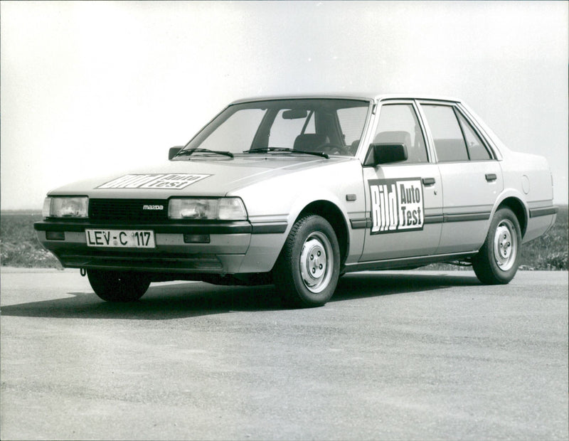 1970 Mazda 626, side and front view - Vintage Photograph