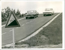 Photo of 2 cars driving on the road - Vintage Photograph