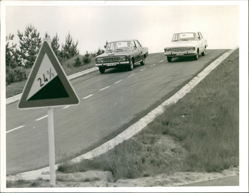 Photo of 2 cars driving on the road - Vintage Photograph