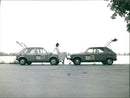 Volkswagen and Peugeot - Vintage Photograph