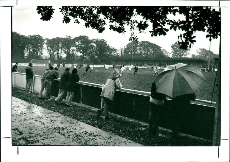 Football fans watching the game - Vintage Photograph