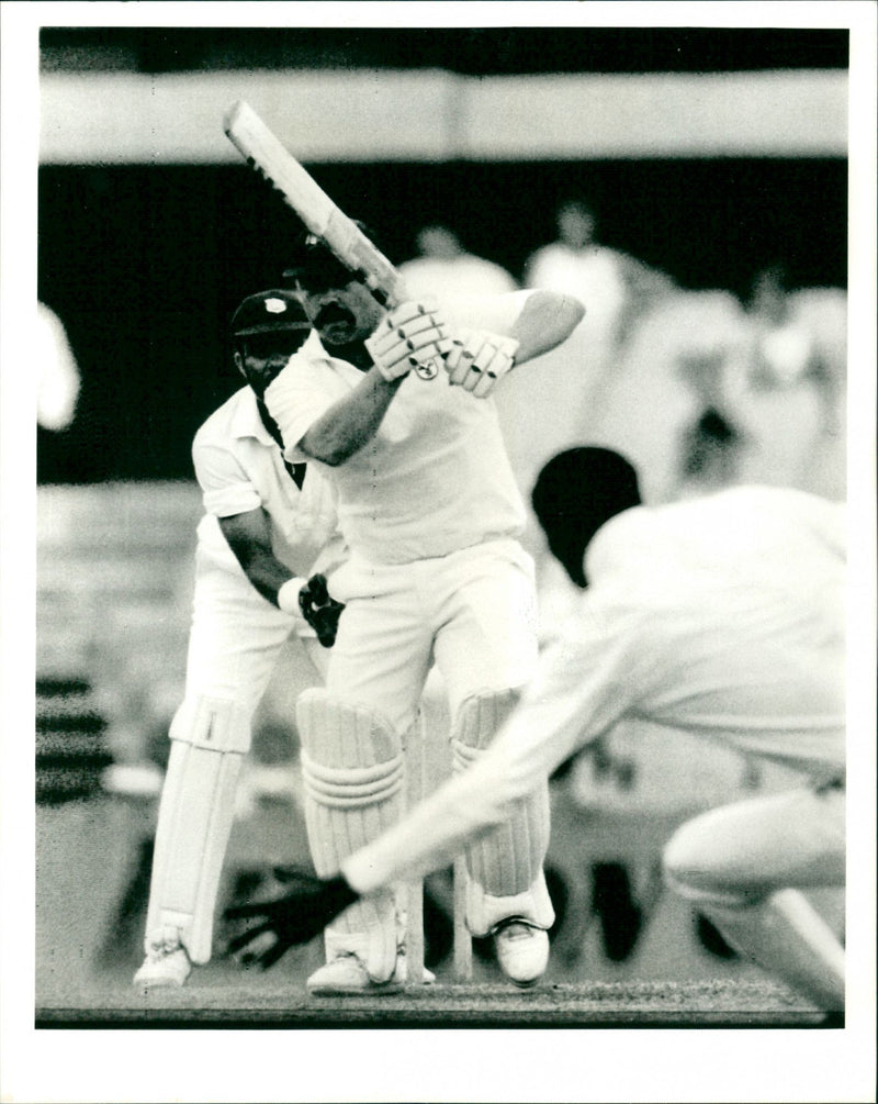 Australian Batsman David Boon drives past bowler Roger Harper - Vintage Photograph