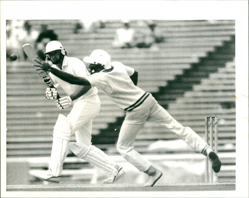 N.Z. batsman Andrew Jones has a lucky escape at the hands of Pakistan Fielder Rizwan - Vintage Photograph