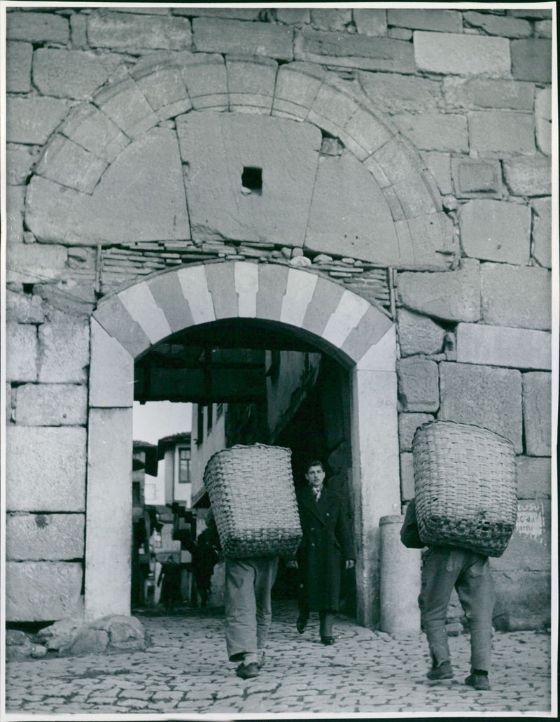 People milling through the gates of the city walls of Istanbul - Vintage Photograph