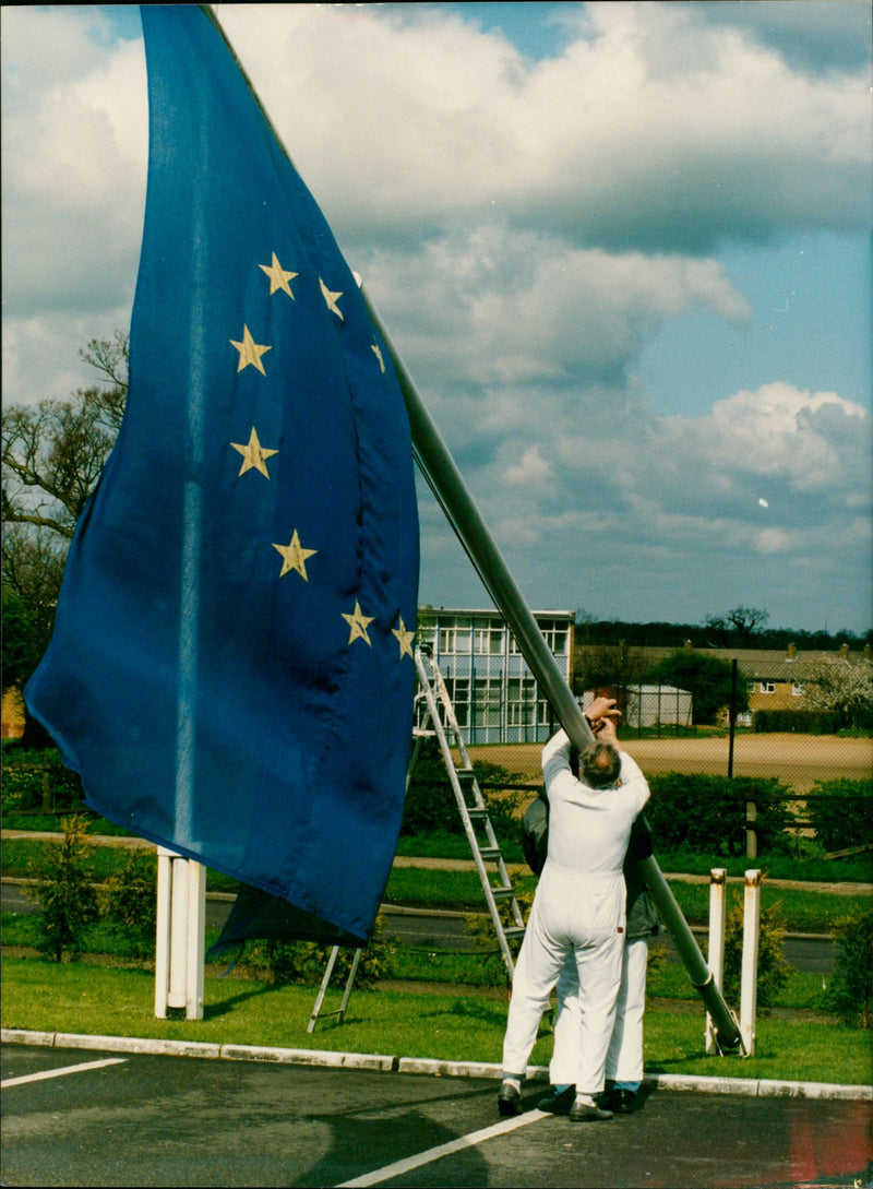 Workmen raising the Euro flag for John Major's visit to Harlow. - Vintage Photograph