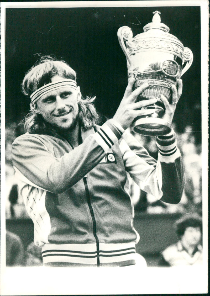 Björn Borg with the victory trophy for the 4th straight title in Wimbledon - Vintage Photograph