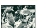 John McEnroe with the Wimbledon trophy - Vintage Photograph