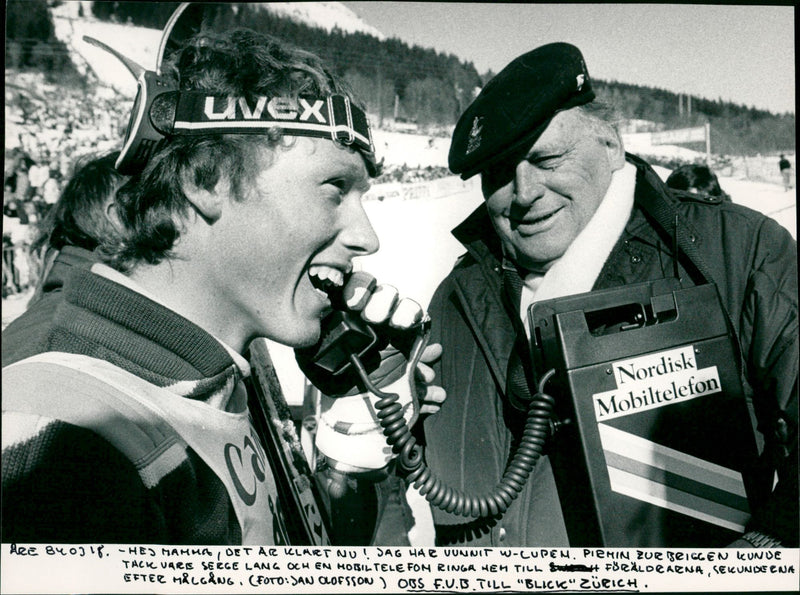 Pirmin Zurbriggen calls home after the victory in Åre. Serge Lang holds the phone - Vintage Photograph