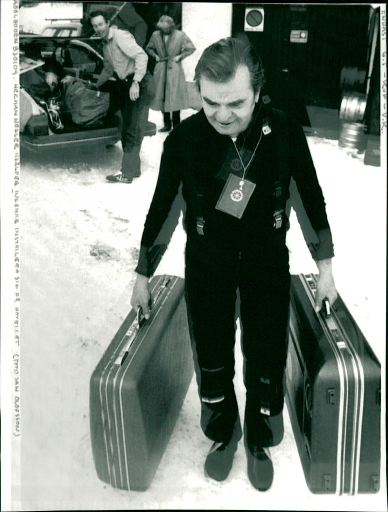 Hermann Nogler helps Ingemar install himself at the hotel in Adelboden - Vintage Photograph