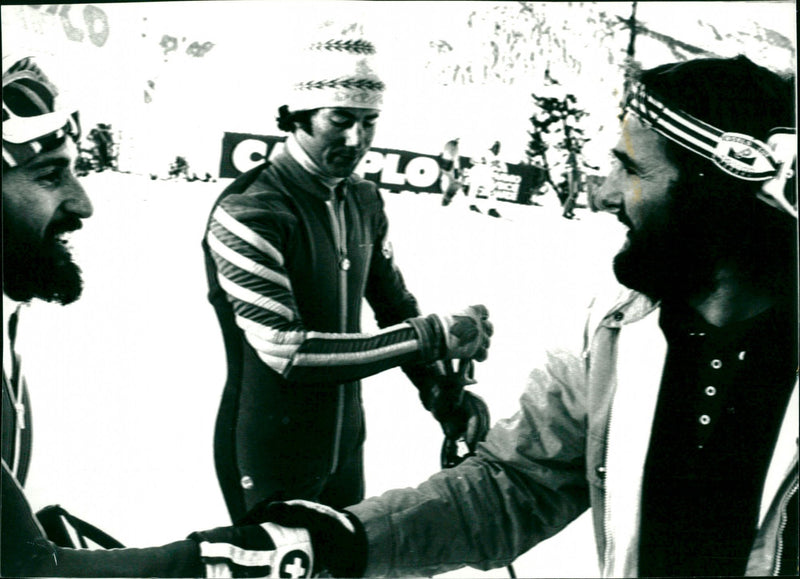 Heini Hemmi and Piero Gros shake hands. Ingemar Stenmark in the middle - Vintage Photograph