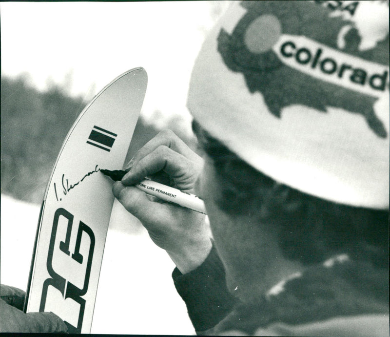 Ingemar Stenmark writes autograph on ski - Vintage Photograph