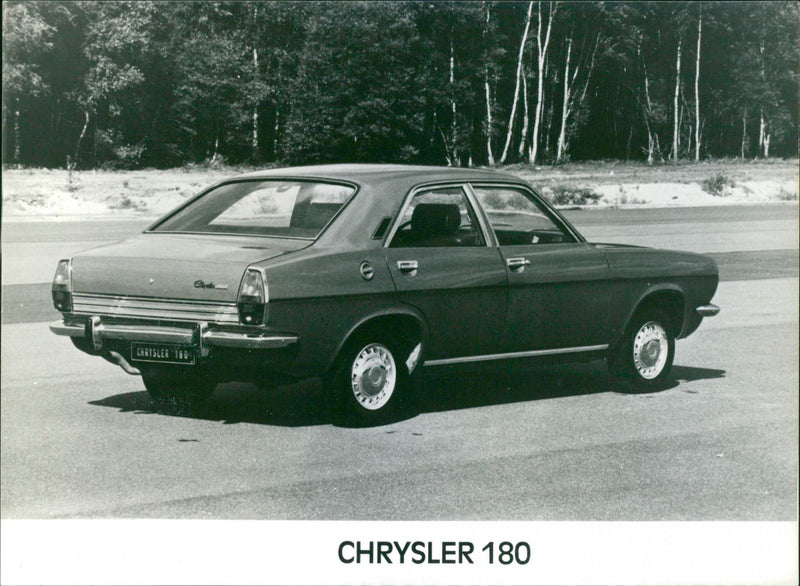 A view of Chrysler 180 on the road - Vintage Photograph