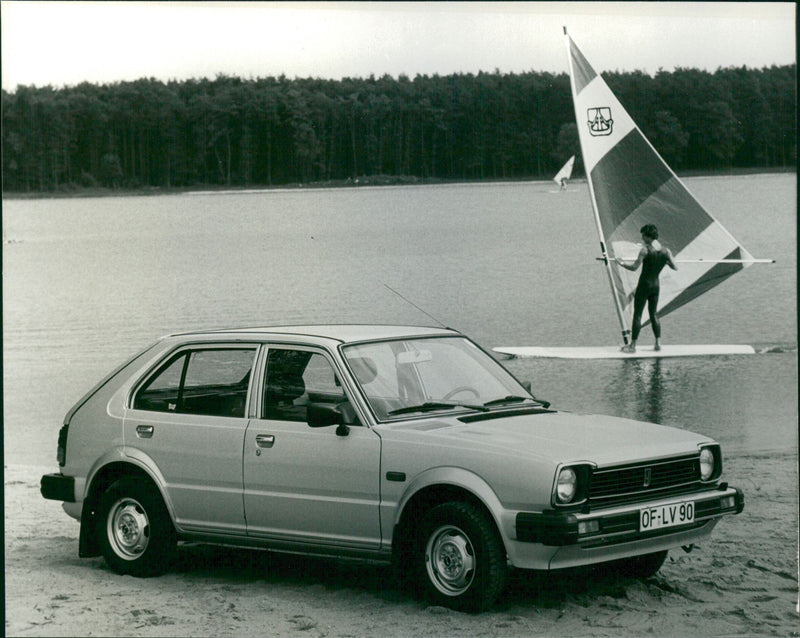 A view of Honda Civic 1300 SL automobile in nature - Vintage Photograph