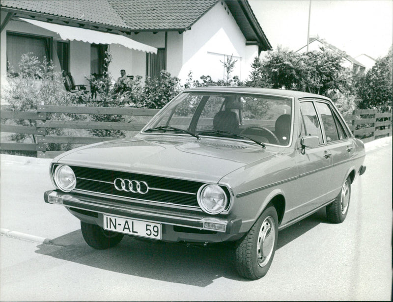 A view of Audi 80 LS parked next to a building - Vintage Photograph
