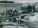 German artillery is brought across a bridge at - Vintage Photograph