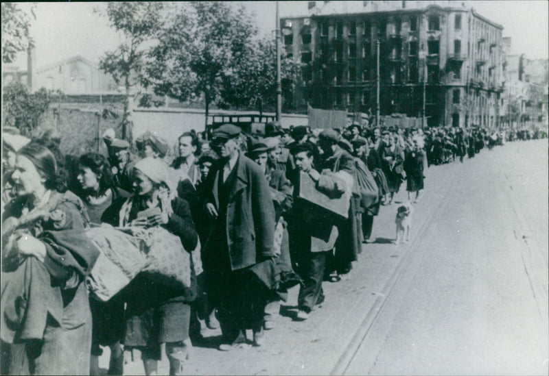 Through Warsaw's streets, a constant stream of refugees pulls away from the burning city - Vintage Photograph