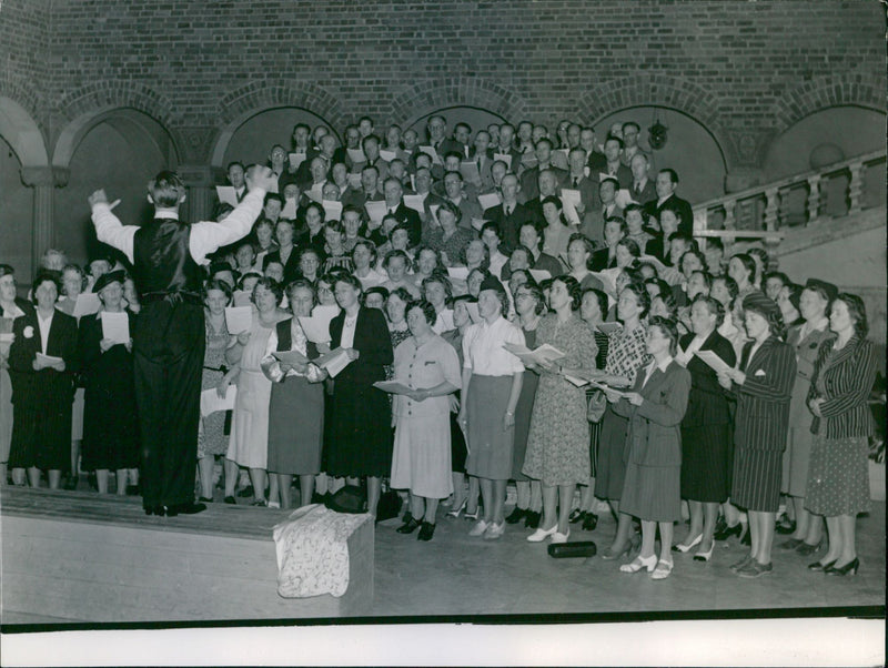 The 100th anniversary of the public school. The anniversary choir rehearses in the Blue Hall - Vintage Photograph