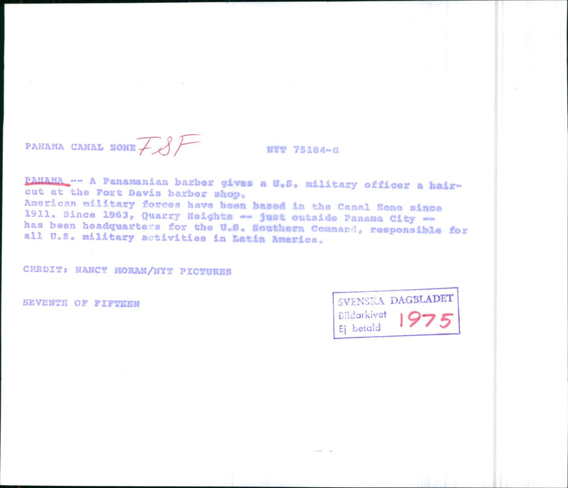 A barber cuts the hair of a US military officer - Vintage Photograph