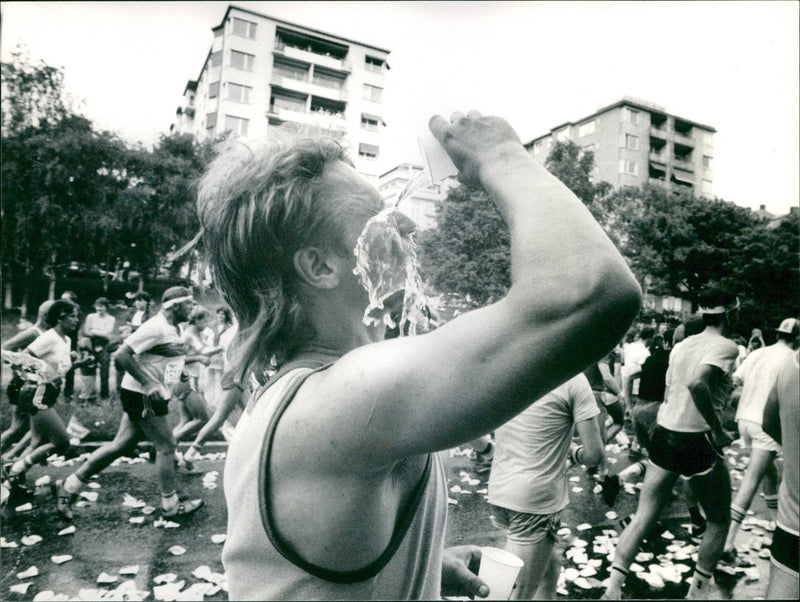 Stockholm Marathon 1984. A cooling mug with water - Vintage Photograph