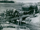 German artillery over field bridge at Warsaw - Vintage Photograph
