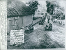 German vehicle troops drive through the muddy streets near Bydgoszcz during the occupation of Poland - Vintage Photograph
