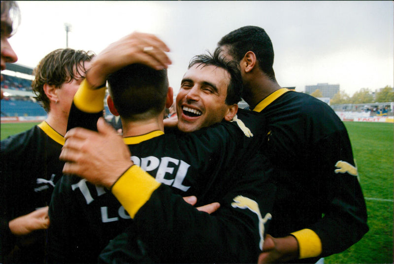 Happy AIK players congratulate each other for the SM gold - Vintage Photograph