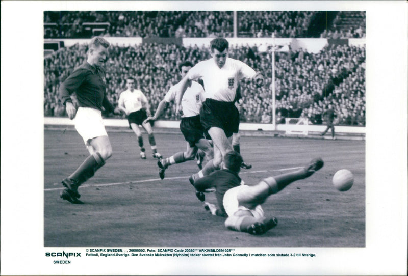 Football England - Sweden. Swedish goalkeeper Nyholm covers John Connelly's shot - Vintage Photograph